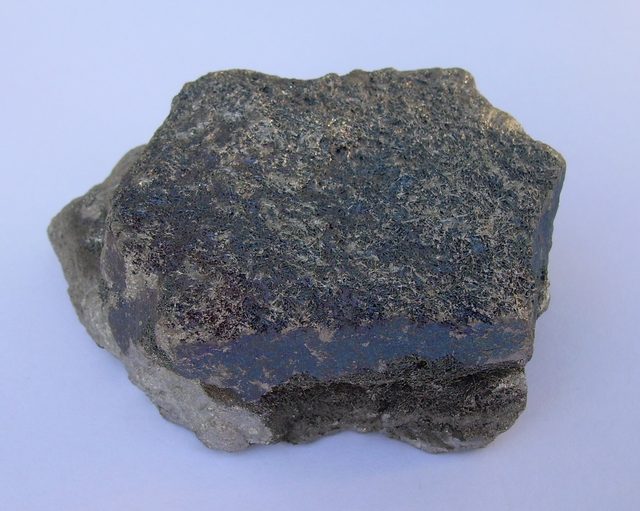 Lump of high carbon ferrochrome alloy showing its metallic grey fracture surface