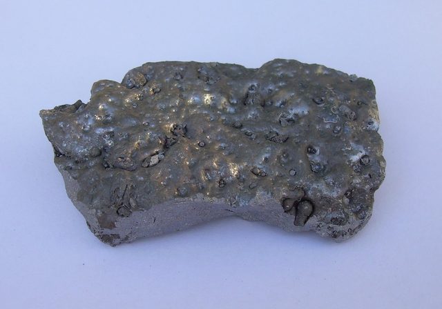 Lump of ferrosilicon alloy with a silvery metallic surface